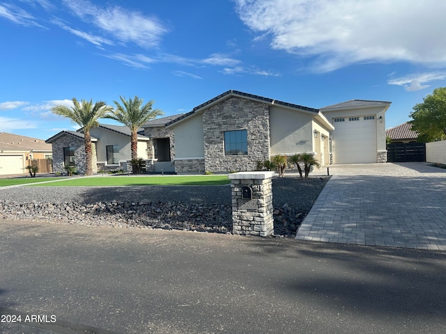 ranch-style house featuring a garage