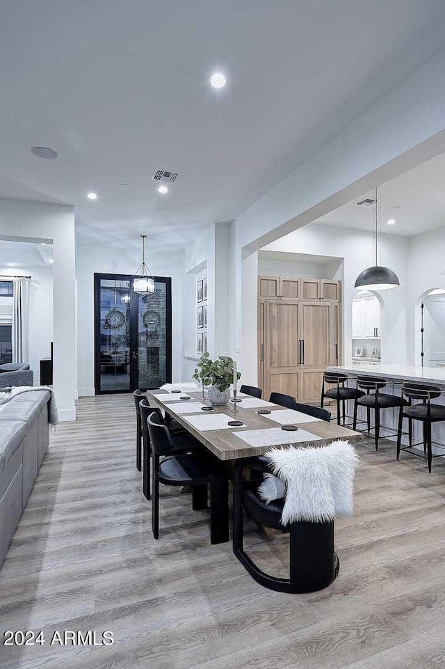 dining space featuring light wood-type flooring