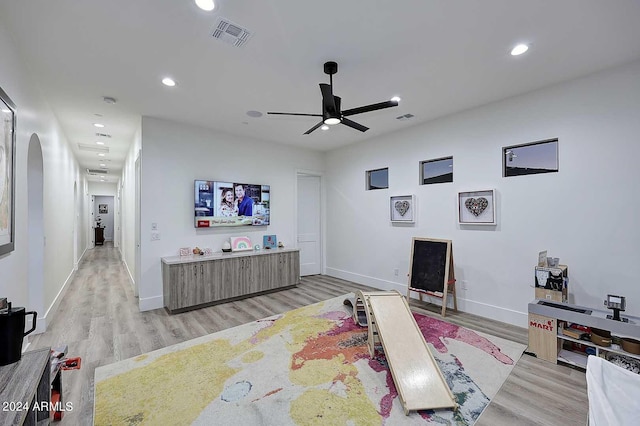 interior space with light wood-type flooring and ceiling fan