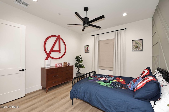 bedroom with light wood-type flooring and ceiling fan