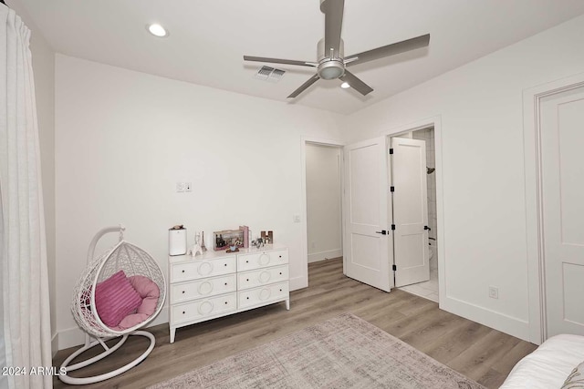 bedroom with ceiling fan and hardwood / wood-style flooring