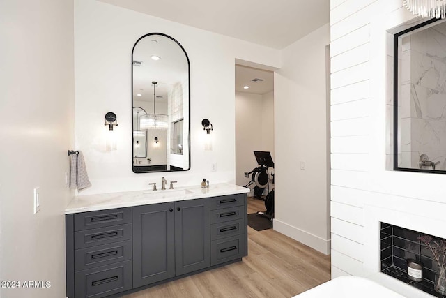 bathroom featuring vanity and hardwood / wood-style flooring