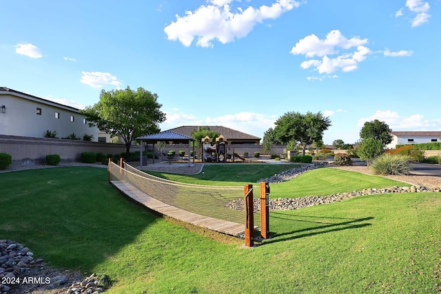 exterior space with a lawn and a gazebo