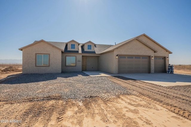 view of front of home featuring a garage