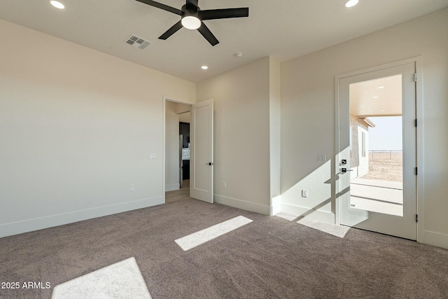 carpeted empty room featuring ceiling fan