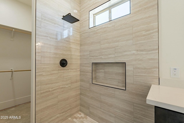 bathroom with tiled shower