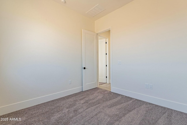 spare room with light carpet