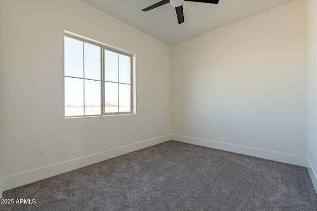 unfurnished room featuring ceiling fan and dark carpet