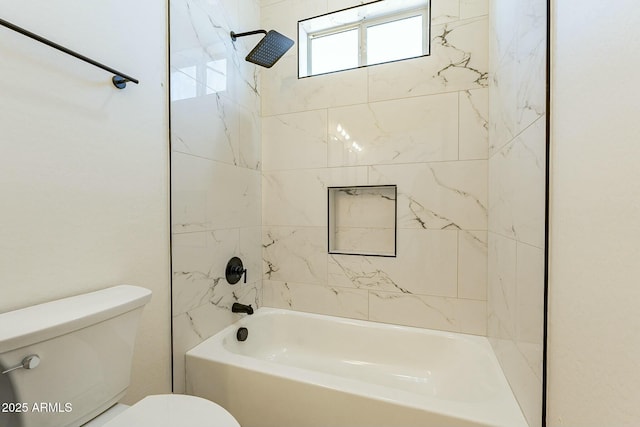 bathroom with toilet and tiled shower / bath combo