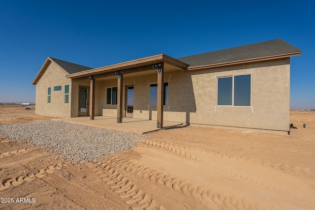 rear view of property with a patio area