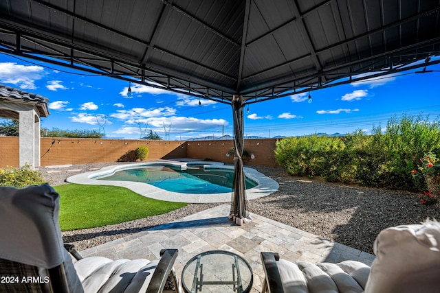 view of swimming pool featuring a gazebo and a patio