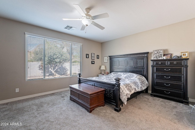 bedroom with light colored carpet and ceiling fan