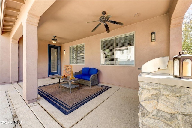 view of patio featuring a ceiling fan