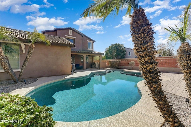 view of swimming pool with a fenced in pool, a patio area, and a fenced backyard