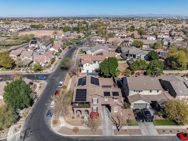 birds eye view of property with a residential view