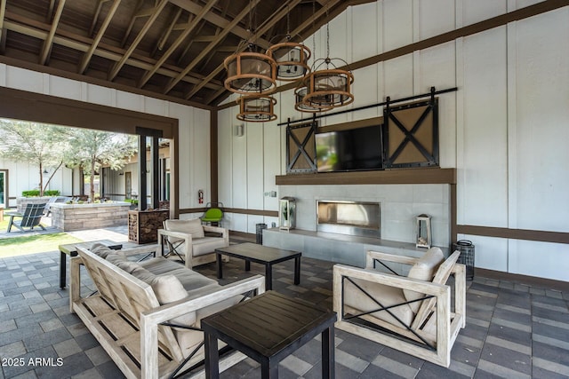 view of patio / terrace featuring an outdoor living space with a fireplace