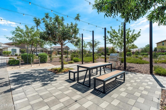 surrounding community with a patio area and fence