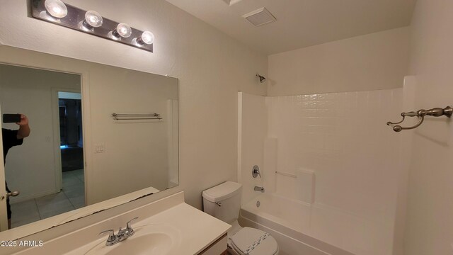 6784 W Gardenia Ave, Glendale, AZ 85303 - full bath with visible vents, vanity, tile patterned floors, toilet, and bathing tub / shower combination