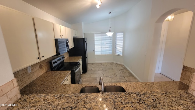 6784 W Gardenia Ave, Glendale, AZ 85303 - kitchen featuring arched walkways, electric range oven, tasteful backsplash, a sink, and lofted ceiling