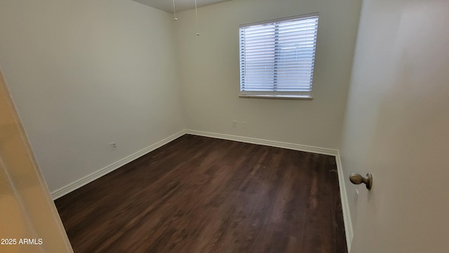 6784 W Gardenia Ave, Glendale, AZ 85303 - spare room featuring baseboards and dark wood finished floors