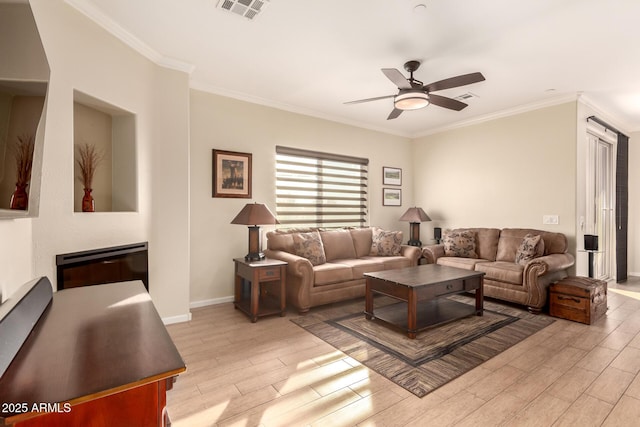 living room featuring ceiling fan, crown molding, and light hardwood / wood-style floors