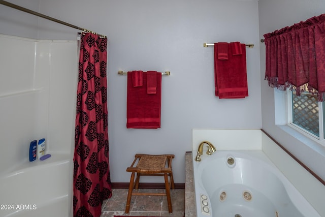 bathroom with shower with separate bathtub