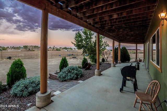 view of patio terrace at dusk