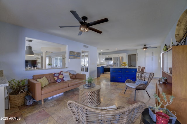 living room featuring ceiling fan