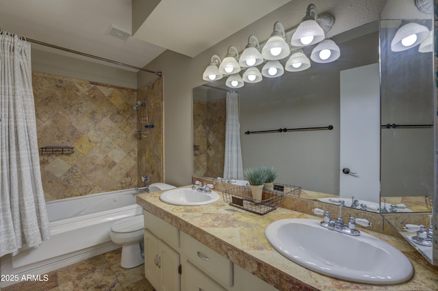 full bathroom featuring vanity, shower / bathtub combination with curtain, and toilet