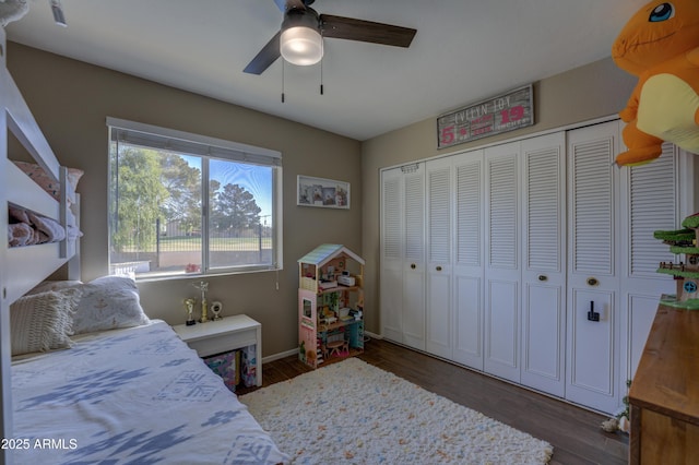 bedroom with ceiling fan, a closet, and dark hardwood / wood-style floors