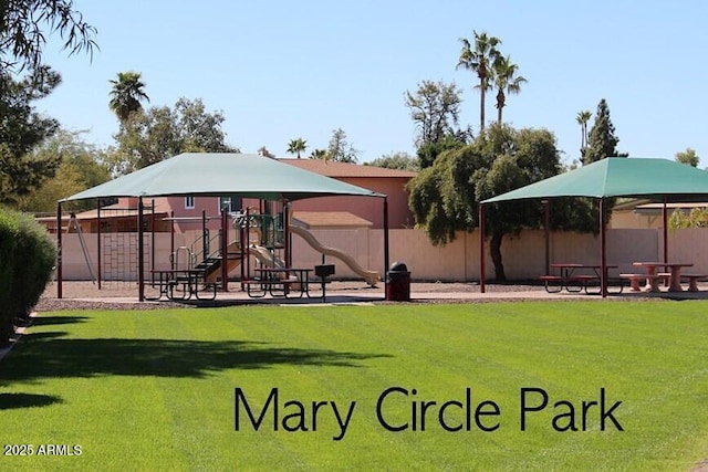 view of community with a playground and a lawn