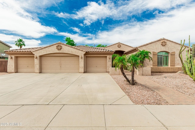 13204 W Palo Verde Dr, Litchfield Park, AZ 85340 - mediterranean / spanish home with concrete driveway, a garage, stucco siding, and a tile roof