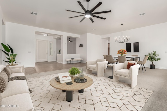 13204 W Palo Verde Dr, Litchfield Park, AZ 85340 - living area featuring ceiling fan, a chandelier, and baseboards