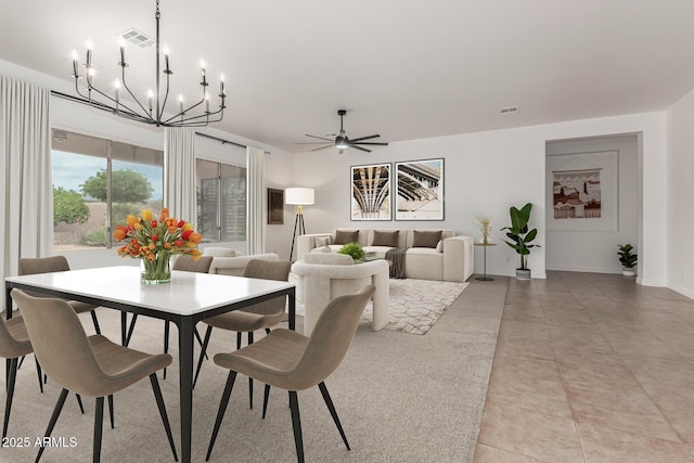 13204 W Palo Verde Dr, Litchfield Park, AZ 85340 - dining room featuring a chandelier, a ceiling fan, and baseboards