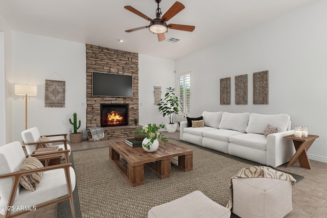 13204 W Palo Verde Dr, Litchfield Park, AZ 85340 - living room with a ceiling fan, light tile patterned flooring, and a fireplace