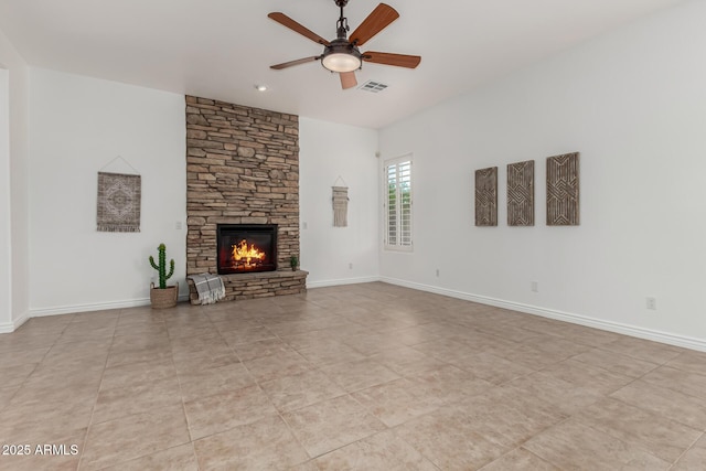 13204 W Palo Verde Dr, Litchfield Park, AZ 85340 - unfurnished living room featuring a ceiling fan, a fireplace, and baseboards