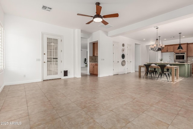 13204 W Palo Verde Dr, Litchfield Park, AZ 85340 - living room with a chandelier, ceiling fan, baseboards, light tile patterned flooring, and recessed lighting