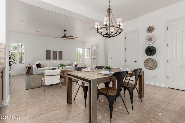 13204 W Palo Verde Dr, Litchfield Park, AZ 85340 - dining space featuring plenty of natural light, a ceiling fan, a chandelier, and baseboards