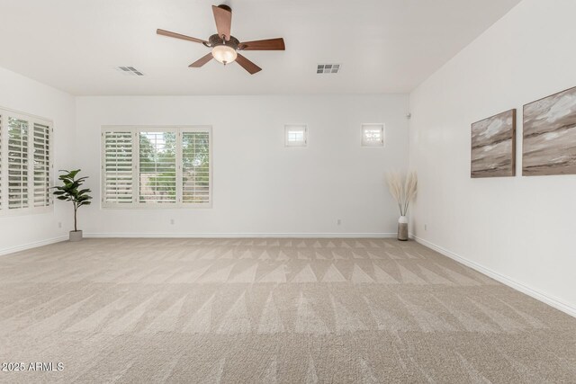 13204 W Palo Verde Dr, Litchfield Park, AZ 85340 - empty room with light colored carpet, a ceiling fan, and baseboards