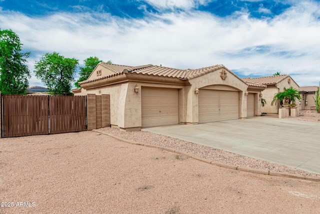 13204 W Palo Verde Dr, Litchfield Park, AZ 85340 - mediterranean / spanish house with a garage, stucco siding, concrete driveway, and a tiled roof