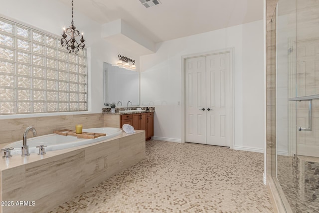 13204 W Palo Verde Dr, Litchfield Park, AZ 85340 - full bath featuring vanity, a stall shower, a garden tub, a chandelier, and baseboards