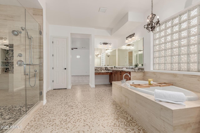 13204 W Palo Verde Dr, Litchfield Park, AZ 85340 - bathroom featuring a shower stall, a garden tub, vanity, and a chandelier
