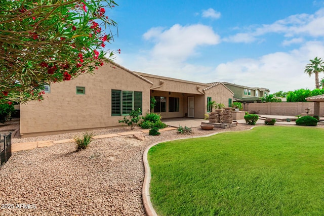 13204 W Palo Verde Dr, Litchfield Park, AZ 85340 - back of property featuring stucco siding and a patio area