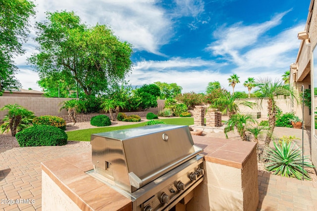 13204 W Palo Verde Dr, Litchfield Park, AZ 85340 - fenced backyard with a patio area