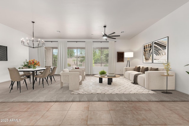 13204 W Palo Verde Dr, Litchfield Park, AZ 85340 - living area featuring light tile patterned flooring, baseboards, a chandelier, and light colored carpet