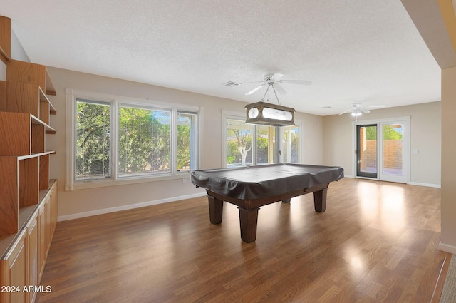 rec room with ceiling fan, dark hardwood / wood-style floors, plenty of natural light, and billiards