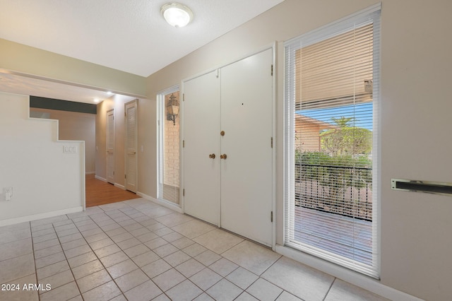 view of tiled entrance foyer