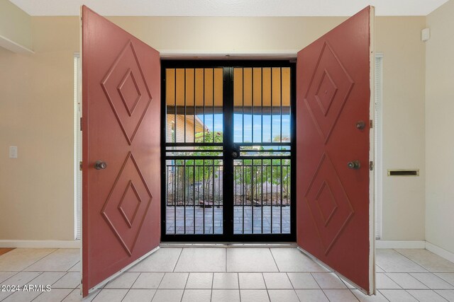 tiled foyer entrance with french doors