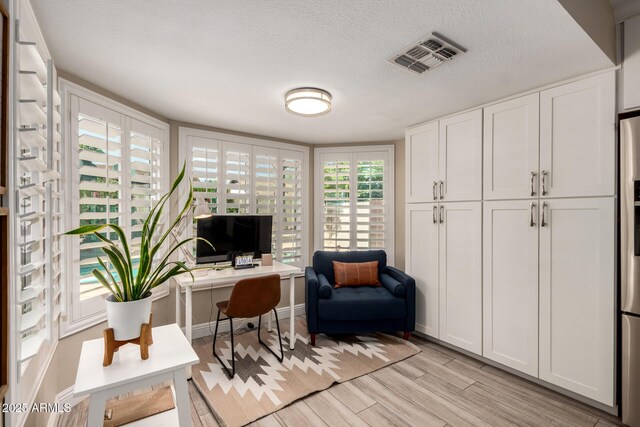 4316 E Janice Way, Phoenix, AZ 85032 - office space featuring light wood-style floors and a textured ceiling