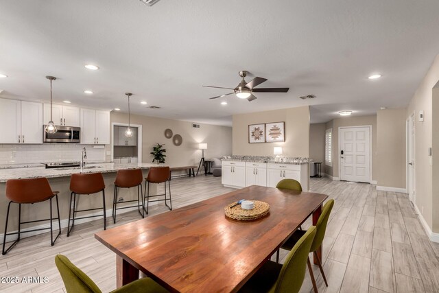 4316 E Janice Way, Phoenix, AZ 85032 - dining space with ceiling fan, recessed lighting, baseboards, and light wood-type flooring